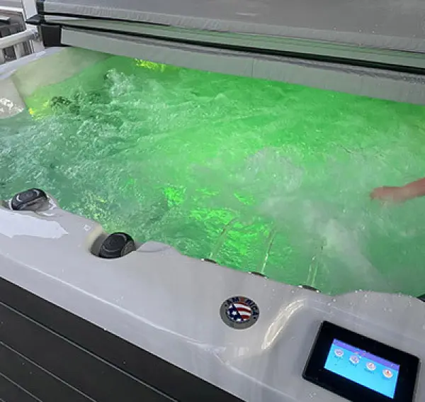 PDC Spas hot tub with LED lighting and touchscreen controls