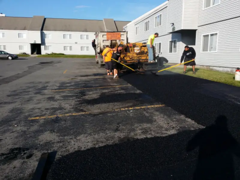 Commercial paving crew working on a parking lot