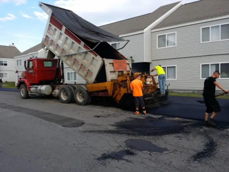 Commercial asphalt paving project outside a business