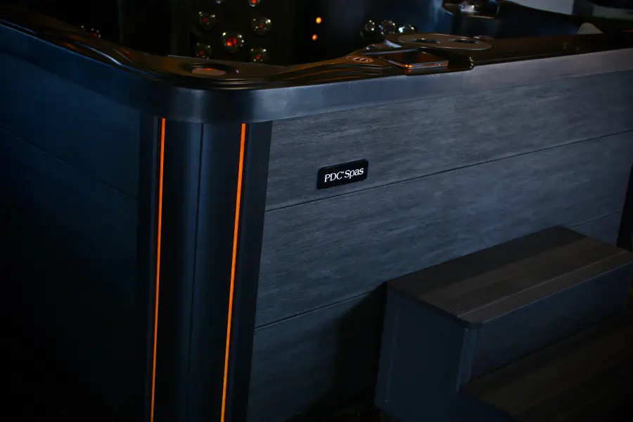 Close-up of LUMINX lighting glowing on the corner of a Midnight Series cabinet