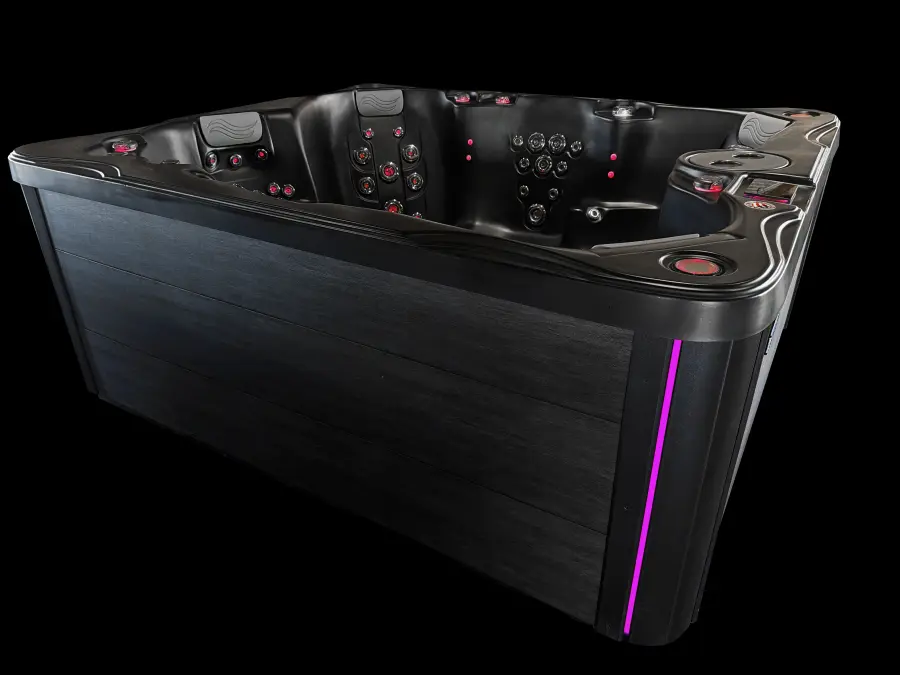 Midnight Fiji hot tub with magenta LUMINX corner lighting